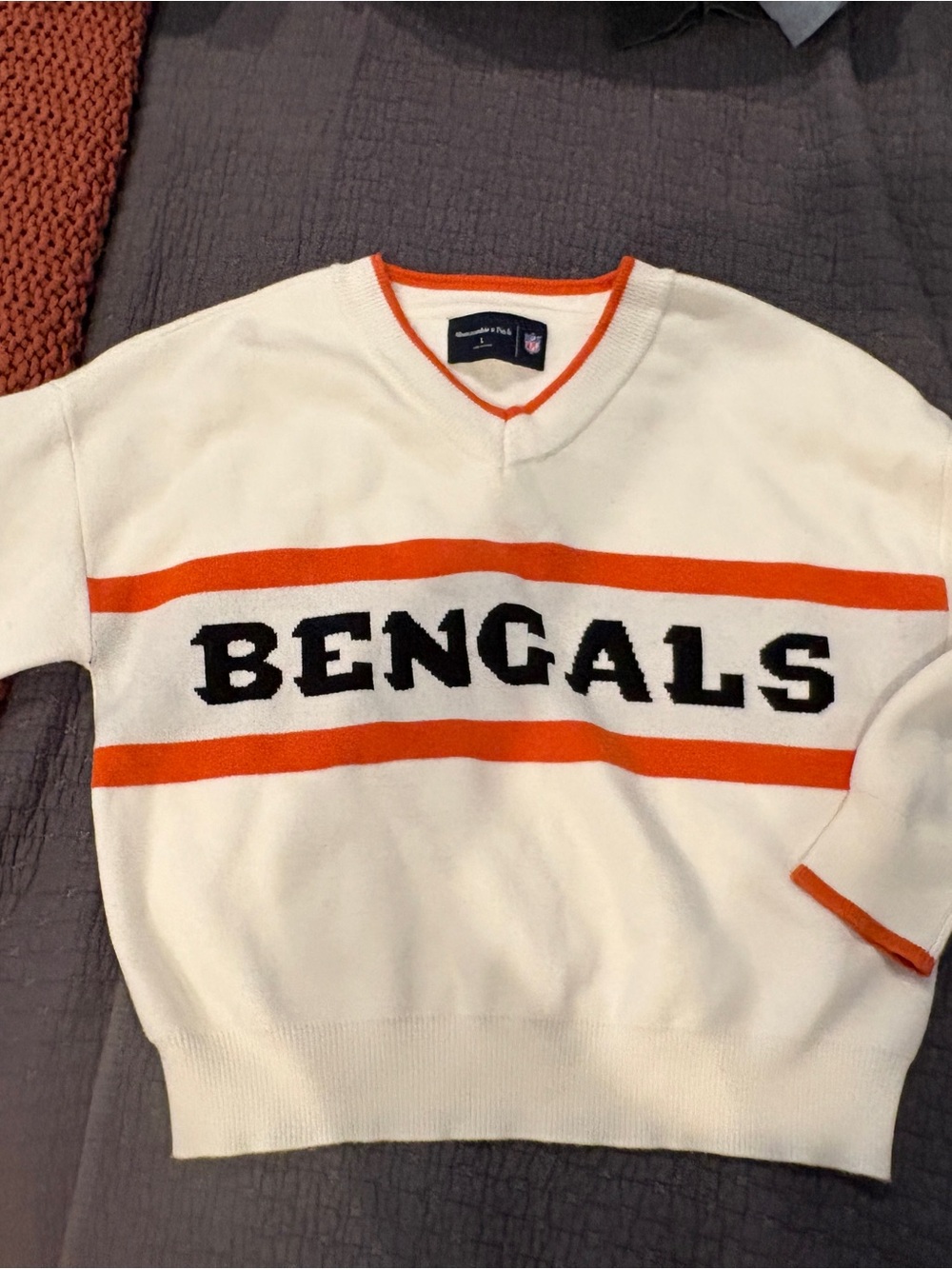 Abercrombie & Fitch White V-Neck Sweater with Orange Stripes & Black Lettering